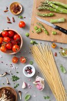 An arrangement of ingredients for pasta dishes with vegetables