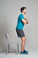Knee bends - Step 1: stand up straight, arms crossed