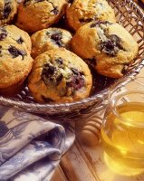 Blueberry muffins and a jar of honey