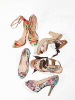 Various high-heeled shoes with floral summer prints