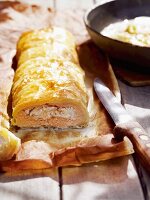 Salmon strudel on baking paper