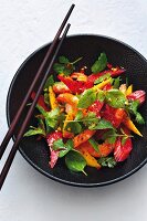 Herb salad with preserved rhubarb, mango and prawns