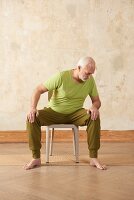 Straddle bend (yoga) – Step 1: sit, bend upper body