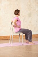 Camel ride, lower spine (yoga) – Step 1: sitting, hands on hips