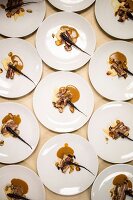 Artfully composed main-course plates for a pop-up fundraiser dinner with seasonal produce