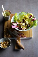Onion and cheese salad with radicchio and peanuts