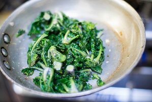 Leaf vegetables in a frying pan