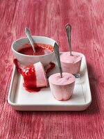 Homemade strawberry ice lolly with strawberry sauce