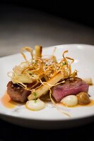 Lamb medallions with salsify, courgette and watercress