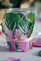 Lantern glass wrapped with brassica and bast leaves