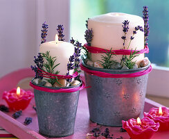 Candles in zinc pots decorated with lavandula (lavender)