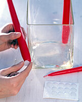 Christmas wreath with glass and cinnamon sticks (red candles)