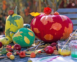 Paint pumpkins with leaf decor