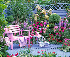 Purple-pink bed in front of blue wickerwork