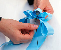 Tying a ribbon