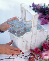 Bouquet of asters in a wooden basket (1/3)