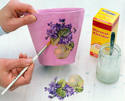 Peonies in pot with violet napkin decoration