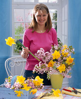 Ornamental cherries and stuck daffodils bouquet