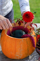 Red autumn bouquet in pumpkin vase (4/5)