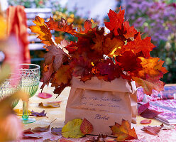 Bouquet made of leaves in paper bag with poem