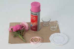 Ranunculus in a cake topping glass