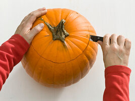 Carved pumpkin as a candleholder and as a vase