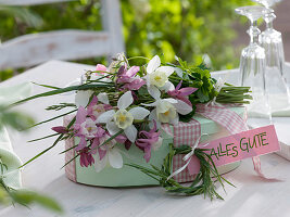 Oval box as a gift with a small Aquilegia bouquet