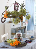 Blossoms and wreaths to dry in and on metal rack