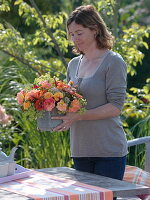 Woman with late summer bouquet