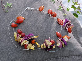 Floral decoration with rose hips and dried rose petals