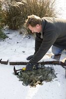 Man hits hole in frozen pond