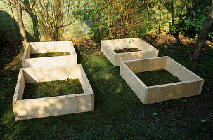WOODEN SCAFFOLDING BOARDS USED TO MAKE RAISED BEDS FOR THE DECORATIVE CHILDRENS POTAGER