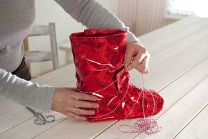 Rubber boots dressed up for Christmas as a planter 4/5