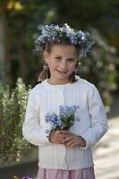 Girl with Myosotis 'Myomark' (forget-me-not)