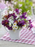 Spring bouquet with gold varnish in ceramic pot