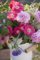 Rural scented bouquet in old milk can