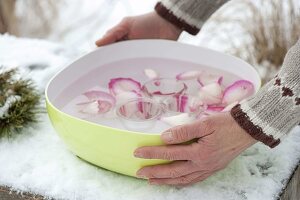 Homemade ice wind lights with rose petals