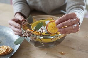 Homemade ice lanterns with orange slices (3/6)