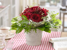 Bouquet of dark red Rosa (roses), Gypsophila (baby's breath)