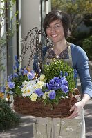 Woman with planted basket: Salix caprea 'Kilmarnock'