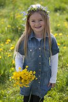 Girl with bouquet of buttercups