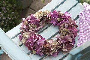 Wreath of hydrangea flowers on chair