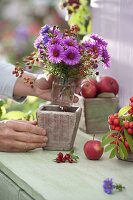 Small bouquet of Aster (white wood aster) and rose (rosehip)