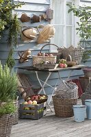 Various baskets hung on the wall, on the table and on the floor