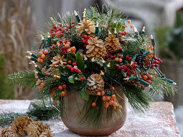 Christmas bouquet with Skimmia (fruit cimmia), bleached cones