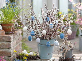 Bouquet of salix caprea twigs in enamel bucket