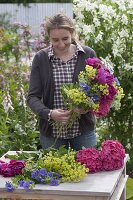 Tying a bouquet of early summer perennials