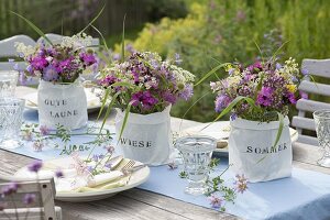 Summer table decoration with meadow flowers