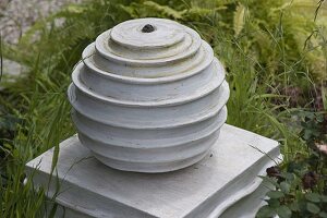 Pottery ball on column as water feature