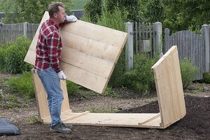 Build a raised flower bed of boards